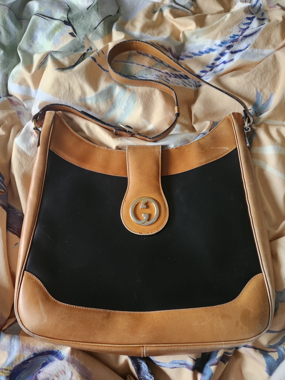 Vintage Gucci hobo shoulder bag featuring black suede and tan leather